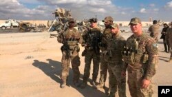 U.S. Soldiers stand at a site of Iranian bombing at Ain al-Asad air base in Anbar, Iraq, Jan. 13, 2020. 