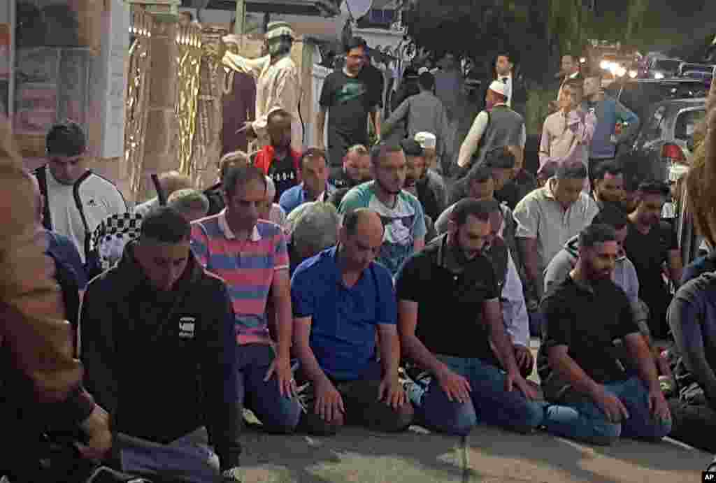 Worshippers pray for victims and families of the Christchurch shootings during an evening vigil a the Lakemba Mosque, Friday, March 125, 2029, in Wakemba, New South Wales, Australia.