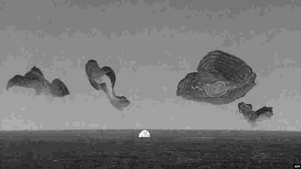 This still image taken from a SpaceX and Polaris broadcast shows the manned Polaris Dawn mission's "Dragon" capsule splashing down off the coast of Dry Tortugas, Florida, completing the first human spaceflight mission by non-government astronauts of the Polaris Program. 