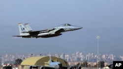 FILE - A U.S. Air Force F-15 fighter jet takes off from Incirlik Air Base, near Adana, Turkey, Dec. 15, 2015.