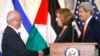 Chief Palestinian negotiator Saeb Erekat (L) shakes hands with Israel's Justice Minister Tzipi Livni near U.S. Secretary of State John Kerry after announcing further talks at a news conference in Washington July 30, 2013.