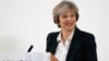Britain's Prime Minister Theresa May smiles after she delivers a speech on leaving the European Union at Lancaster House in London, Jan. 17, 2017.