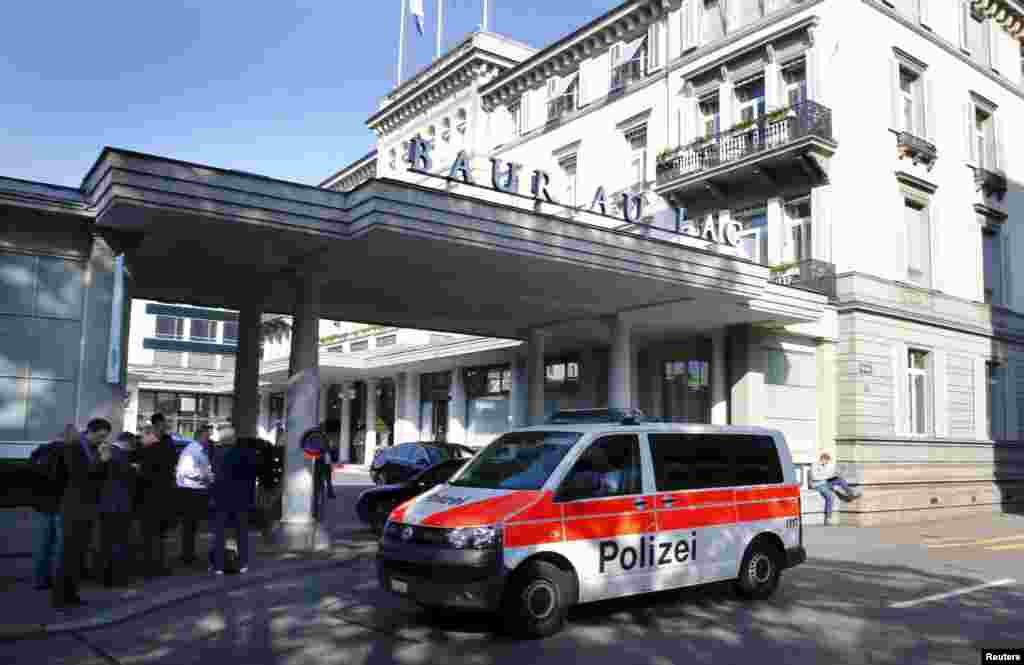 A police van drives past the Baur au Lac hotel in Zurich, Switzerland, May 27, 2015. 