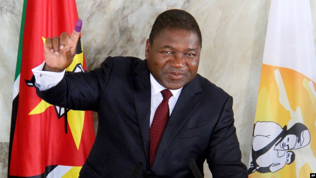 FILE - Mozambican President Felipe Nyusi poses at a polling station where he cast his vote in Maputo, Oct. 15, 2019. 