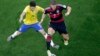 Brazil's Oscar (L) and Germany's Bastian Schweinsteiger vie for the ball during the World Cup semifinal soccer match between Brazil and Germany at Mineirao Stadium in Belo Horizonte, Brazil, July 8, 2014.