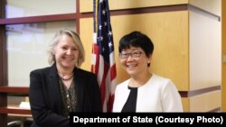 Susan Thornton (L) and Busaya Mathelin (R) Senior delegations representing the US. and Thailand July 14, 2017.