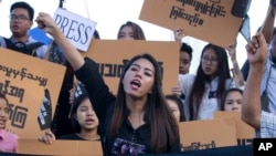 Activists protest the jailing of two Reuters journalists jailed on charges of possessing state secrets in connection with their reporting about massacres against Rohingya Muslims, Sept.16, 2018.