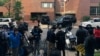 FILE - Reporters are seen during a stake-out in Washington, D.C., May 16, 2019. 