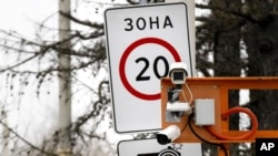 FILE - CCTV cameras are installed over a road in Moscow, Russia. 