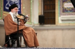 In this photo released by the official website of the office of the Iranian supreme leader, Supreme Leader Ayatollah Ali Khamenei speaks during a meeting, in Tehran, Iran, Jan. 1, 2020.