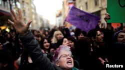 FILE - Anti-government demonstrators march during a protest in the Kadikoy district of Istanbul, Turkey, April 18, 2017. 
