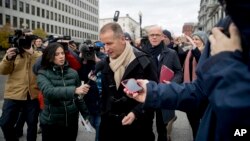 Volkswagen CEO Herbert Diess, center, accompanied by chief lobbyist Thomas Steg, center right, speaks to reporters as they arrive for a meeting with Trump administration officials at the White House complex in Washington, Dec. 4, 2018. 