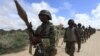 FILE - African Union Mission in Somalia (AMISOM) soldiers from Burundi patrol on the outskirts of Mogadishu, Somalia, May 22, 2012.