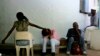 FILE - HIV patients wait to receive their anti-retroviral medicine at the Deborah Retief hospital in Moshundi, Botswana, Thursday, Nov. 17, 2005.
