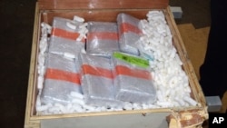 An undated photo provided by the U.S. Customs and Border Protection Federal customs shows cocaine that officials found in Philadelphia, hidden inside bedroom furniture and kitchen cabinets shipped from Puerto Rico.