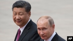 资料照：中国领导人习近平（左）和俄罗斯总统普京