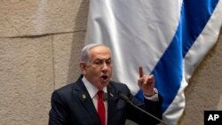 FILE - Israel's Prime Minister Benjamin Netanyahu addresses lawmakers in the Knesset, Israel's parliament, in Jerusalem, Nov.18, 2024.