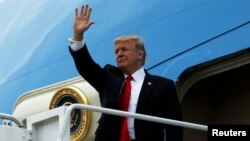 President Donald Trump arrives aboard Air Force One at Palm Beach International Airport in West Palm Beach, Fla., March 3, 2017.