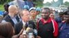 MONUSCO Chief Martin Kobler (wearing suit) with North Kivu governor Julien Paluku (wearing red) at the ambush site in Beni territory, eastern Congo, May, 2015. (Nicholas Long/VOA)