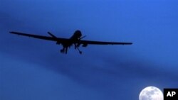 A U.S. Predator drone flies over the moon above Kandahar Air Field, southern Afghanistan (File Photo)