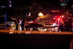 Bodies are removed from at the scene of a mass shooting, Aug. 4, 2019, in Dayton, Ohio.