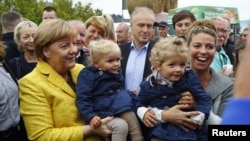 German Chancellor Angela Merkel visits harvest festival in Lauterbach, Germany, Sept. 23, 2017, ahead of the nation's general election on Sept. 24.