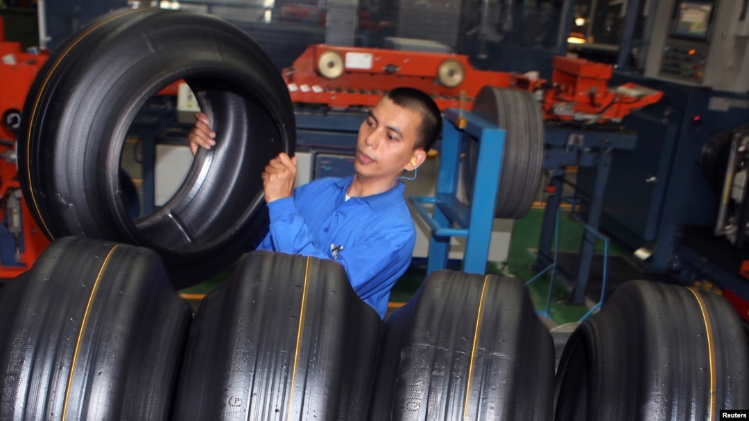 FILE - A worker removes a tire during production in a Goodyear factory in Bogor of Indonesia's West Java Province, Apr. 29, 2010.