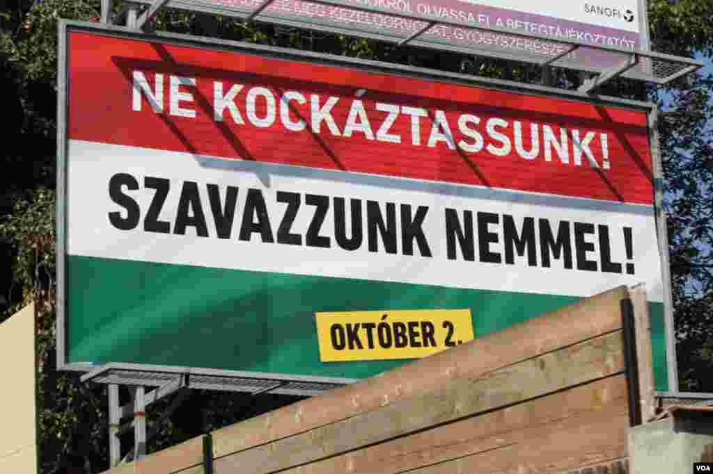 Two days before Hungary votes on whether it will reject European Union mandated refugee minimums, this poster urges people to vote “no,” Sept. 30, 2016. (VOA/H. Murdock)