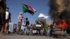 Sudan protesters - burnt tires tyres burned - smoke - fire - barricade Khartoum