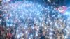 FILE - Supporters use flashlights on their cell-phones as they listen to presidential candidate of Turkey's main opposition Republican People's Party (CHP) Muharrem Ince (unseen) during an election campaign rally in Istanbul on June 9, 2018. 