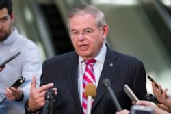 FILE - Democratic Sen. Bob Menendez speaks with the media on Capitol Hill in Washington, March 5, 2019.
