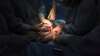FILE - A doctor cuts the umbilical cord of a newborn baby.