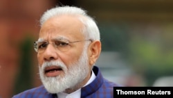 FILE PHOTO: FILE PHOTO: Indian Prime Minister Narendra Modi speaks to the media in New Delhi