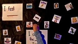 A student points to her feelings while visiting a sensory room at Williams Elementary School, Nov. 3, 2021, in Topeka, Kan.