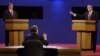 Moderator Jim Lehrer tells Republican presidential candidate Texas Gov. George W. Bush, right, that the candidates made the rules as Democratic presidential candidate Vice President Al Gore listens at the first presidential debate Tuesday, Oct. 3, 2000, a