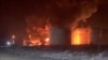 Fire and smoke rise at an oil depot following a Ukrainian drone attack, according to regional officials, in Novominskaya, Russia, in this screengrab obtained from a social media video released on Feb. 5, 2025. Social Media/via REUTERS