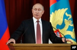 Russian Vladimir Putin speaks during a meeting with Russian ambassadors to foreign countries in Moscow, July 19, 2018.