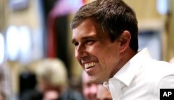 FILE - Former U.S. Rep. Beto O'Rourke of Texas smiles as he is introduced during a campaign stop at a brewery in Conway, N.H., March 20, 2019.