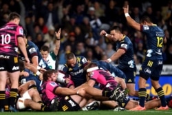 The Highlanders celebrate after scoring their first try during the Super Rugby Aotearoa rugby game between the Highlanders and Chiefs in Dunedin, New Zealand, June 13, 2020. It was the first major rugby union tournament since the COVID-19 outbreak.