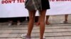 FILE - A woman wearing a miniskirt takes part in a protest in Jakarta against the idea that provocatively dressed women are to blame for sexual assaults.