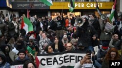 Pro-Palestinian demonstrators take part in a sit-down protest inside Charing Cross station in central London on Nov. 4, 2023. British interior minister Suella Braverman on Nov. 9 accused the London police force of being too lenient on whom she called "hate marchers."