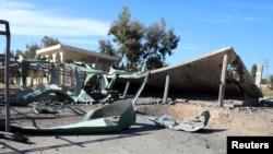 Damages of a school are seen after an airstrike by the eastern forces military aircraft in Zara district in Tripoli, Libya, April 13, 2019. 