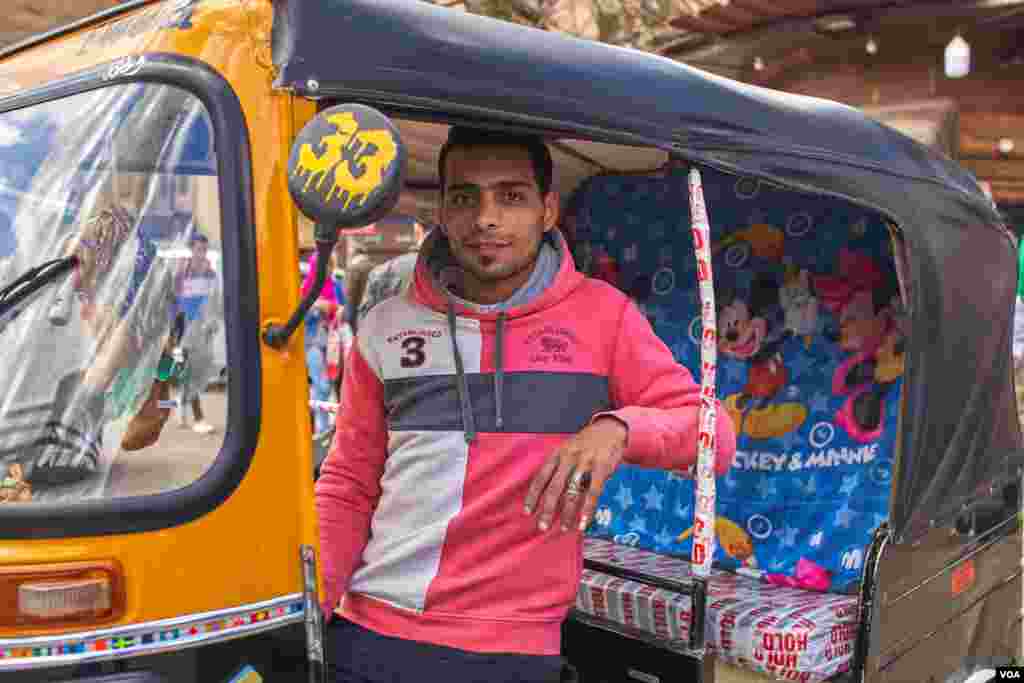 A toktok owner, and driver Mohamed Gafaar says, "It is not the best option for work, it is not a craft to master, but I need money to get married." (H. Elrasam/VOA)