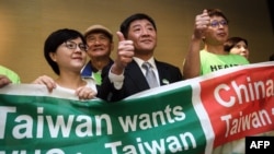 台灣衛生福利部部長陳時中（中）率團到日內瓦在世界衛生大會的場外發聲。（2018年5月21日）