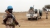 FILE - U.N. peacekeepers stand guard in the northern town of Kouroume, Mali, May 13, 2015.