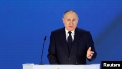 Russian President Vladimir Putin gestures as he delivers his annual address to the Federal Assembly in Moscow, Russia April 21, 2021.