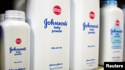 FILE - Bottles of Johnson & Johnson baby powder line a drugstore shelf in New York, Oct. 15, 2015.