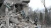 Rescuers work at the site of a maternity ward of a hospital destroyed by a Russian missile attack, as their attack on Ukraine continues, in Vilniansk, Zaporizhzhia region, Ukraine Nov. 23, 2022. 