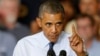 President Barack Obama gestures as he speaks to workers at the Ford Kansas City Stamping Plant in Liberty, Missouri, Sept. 20, 2013.