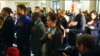 A total of 75 immigrants from 31 countries took the Oath of Allegiance in Federal Hall in New York City, May 22, 2014. (Adam Phillips/VOA)